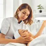 what is esthetics? esthetician performing a facial on a client